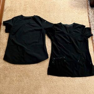Two black scrub tops.